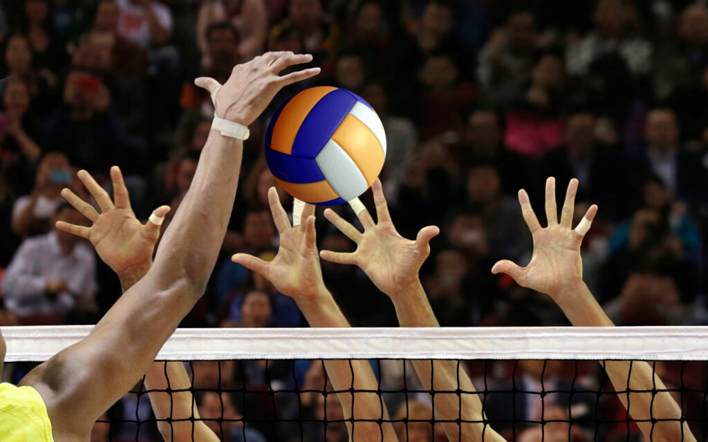 Volleyball spike blocking in front of the net