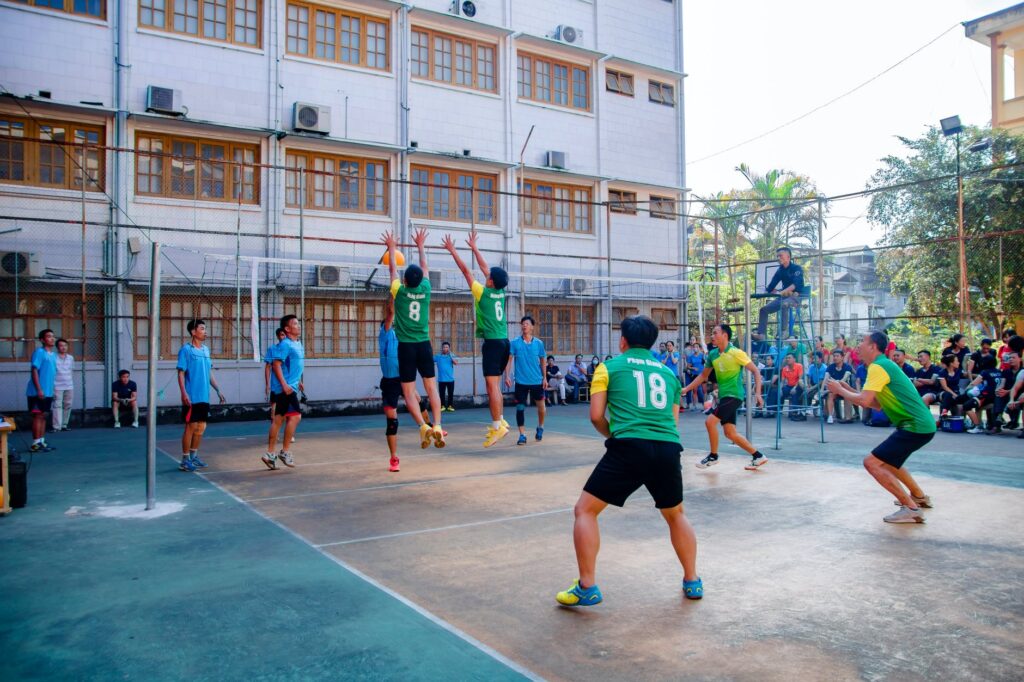 group of men playing volleyball