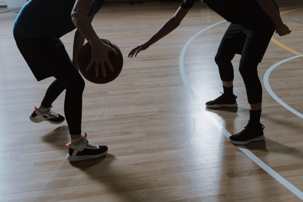 A Person Holding the Basket Ball in Front of a Person